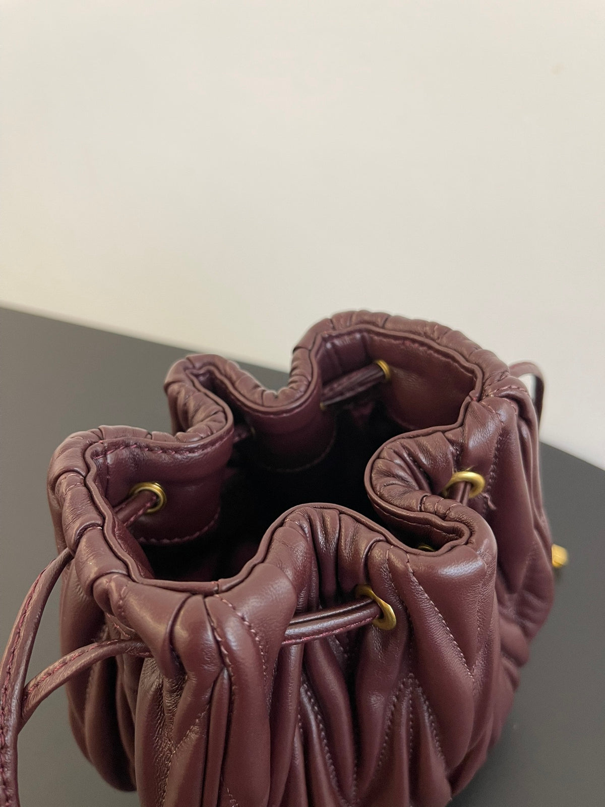 Miu Miu Matelassé Drawstring Mini Bag – Burgundy