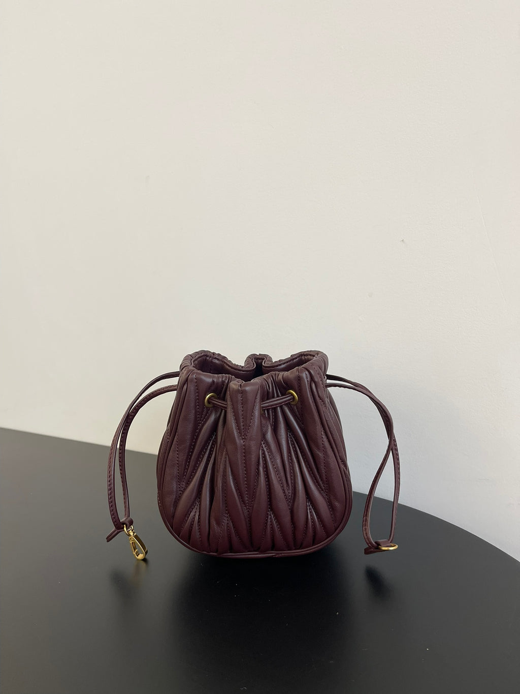 Miu Miu Matelassé Drawstring Mini Bag – Burgundy