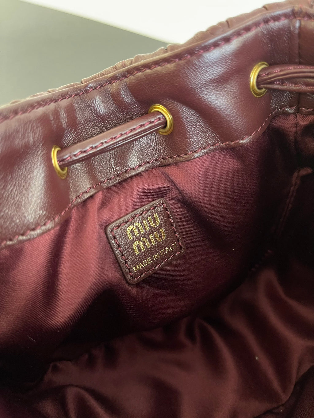 Miu Miu Matelassé Drawstring Mini Bag – Burgundy