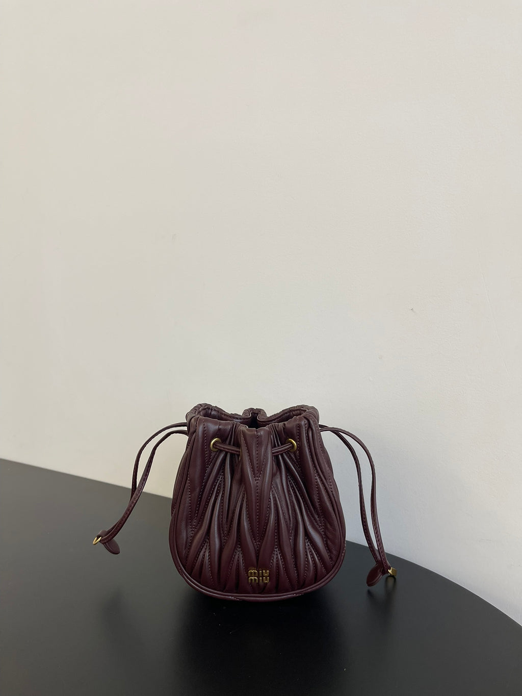 Miu Miu Matelassé Drawstring Mini Bag – Burgundy
