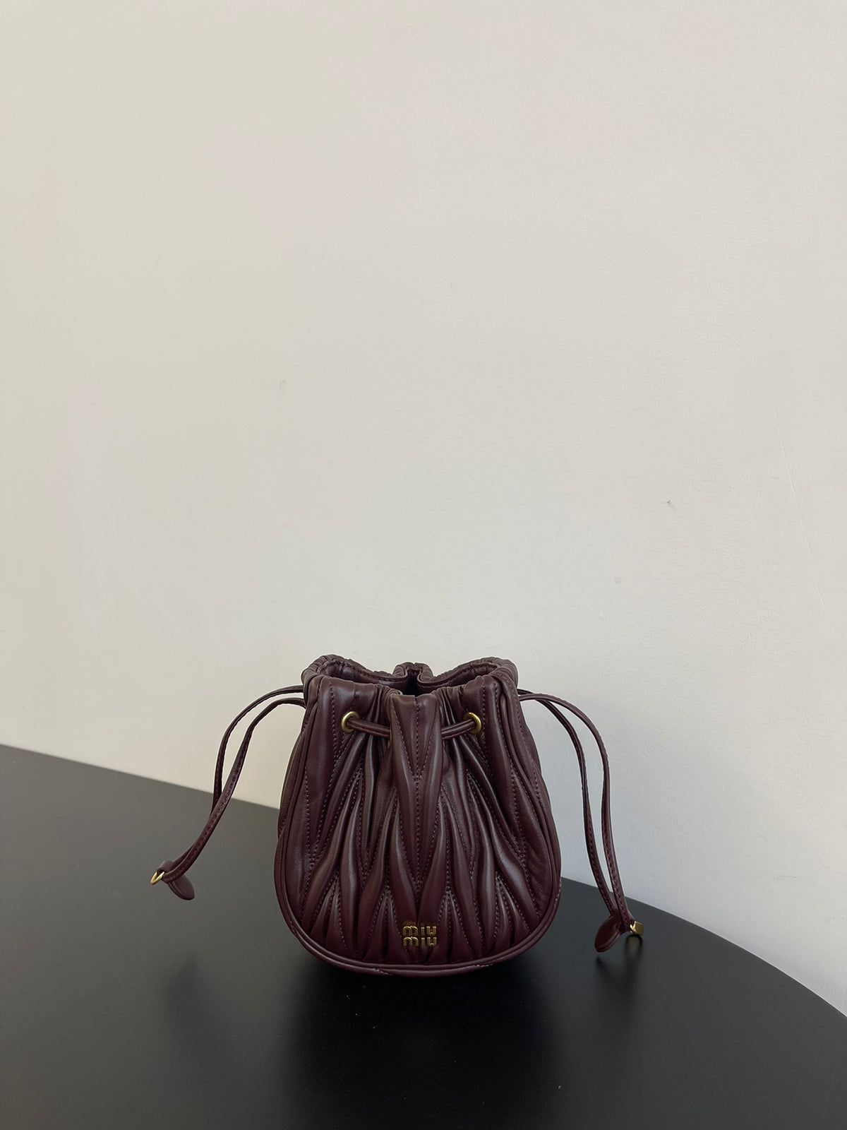 Miu Miu Matelassé Drawstring Mini Bag – Burgundy
