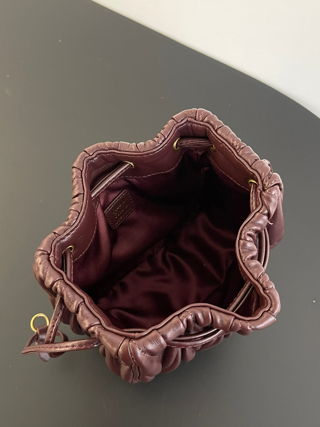 Miu Miu Matelassé Drawstring Mini Bag – Burgundy