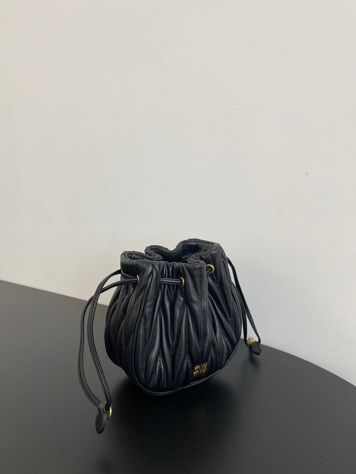 Miu Miu Matelassé Drawstring Mini Bag – Black