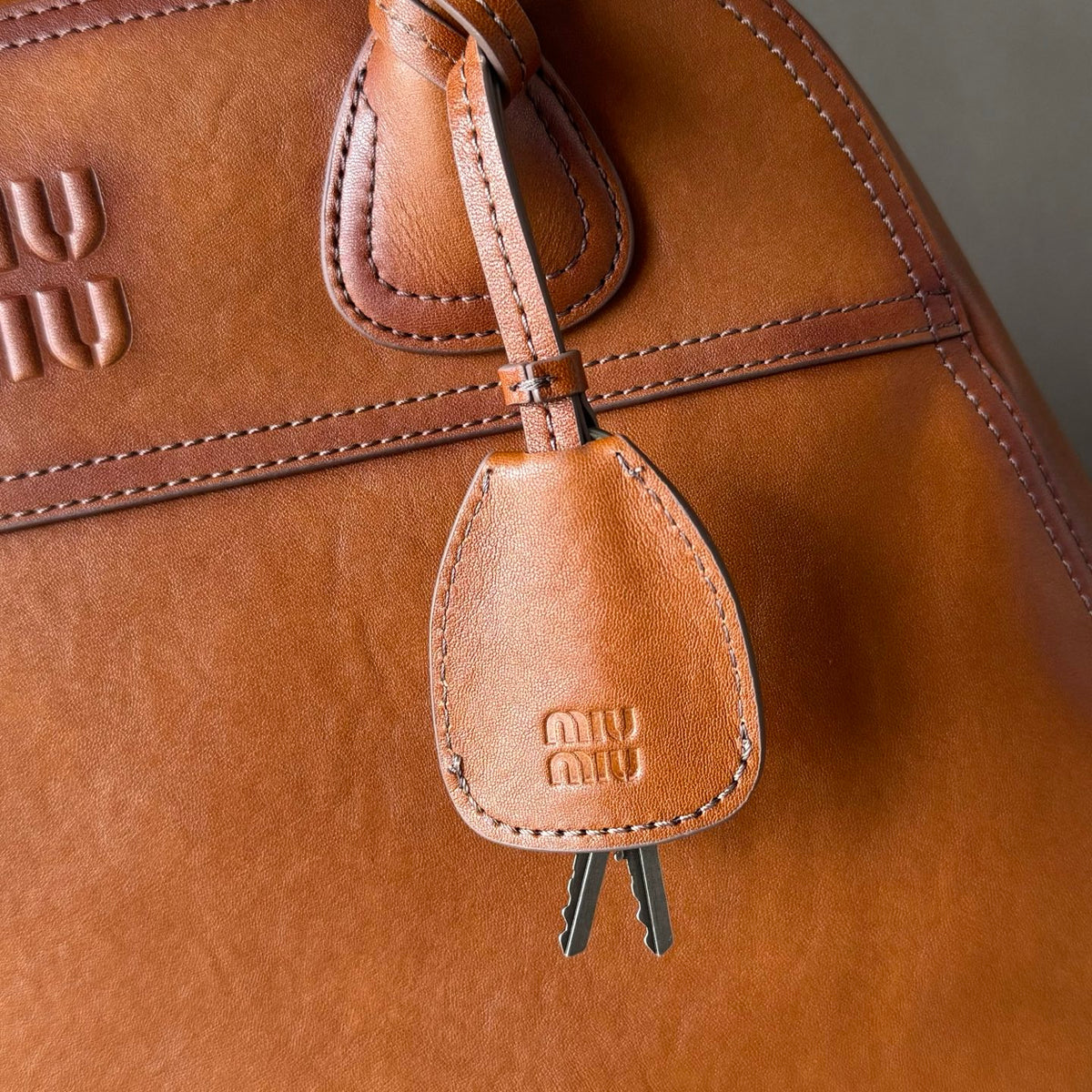 Miu Miu Aventure Leather Top Handle Bag – Cognac